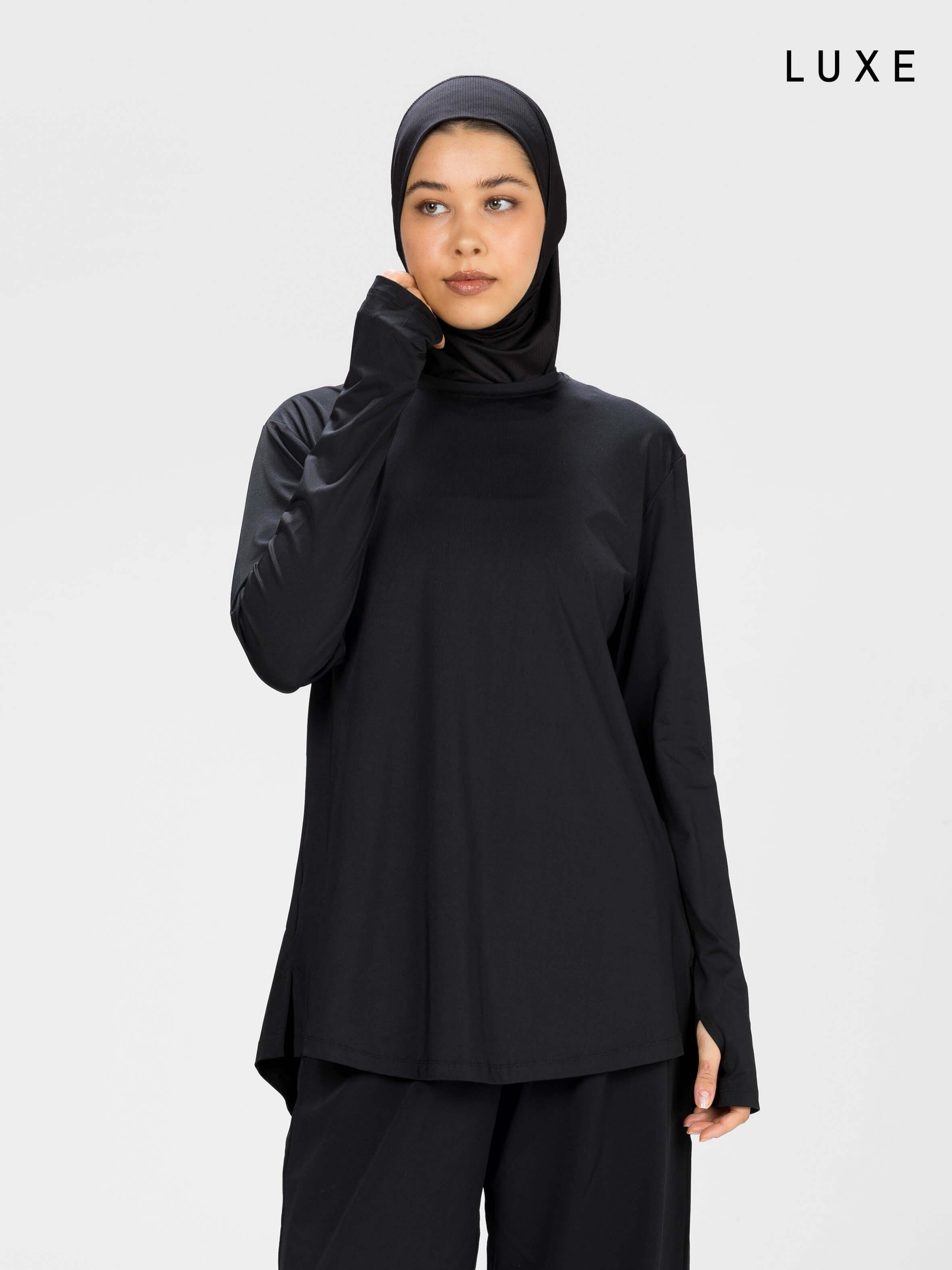 Women black long-sleeve modest sports activewear top by KAF