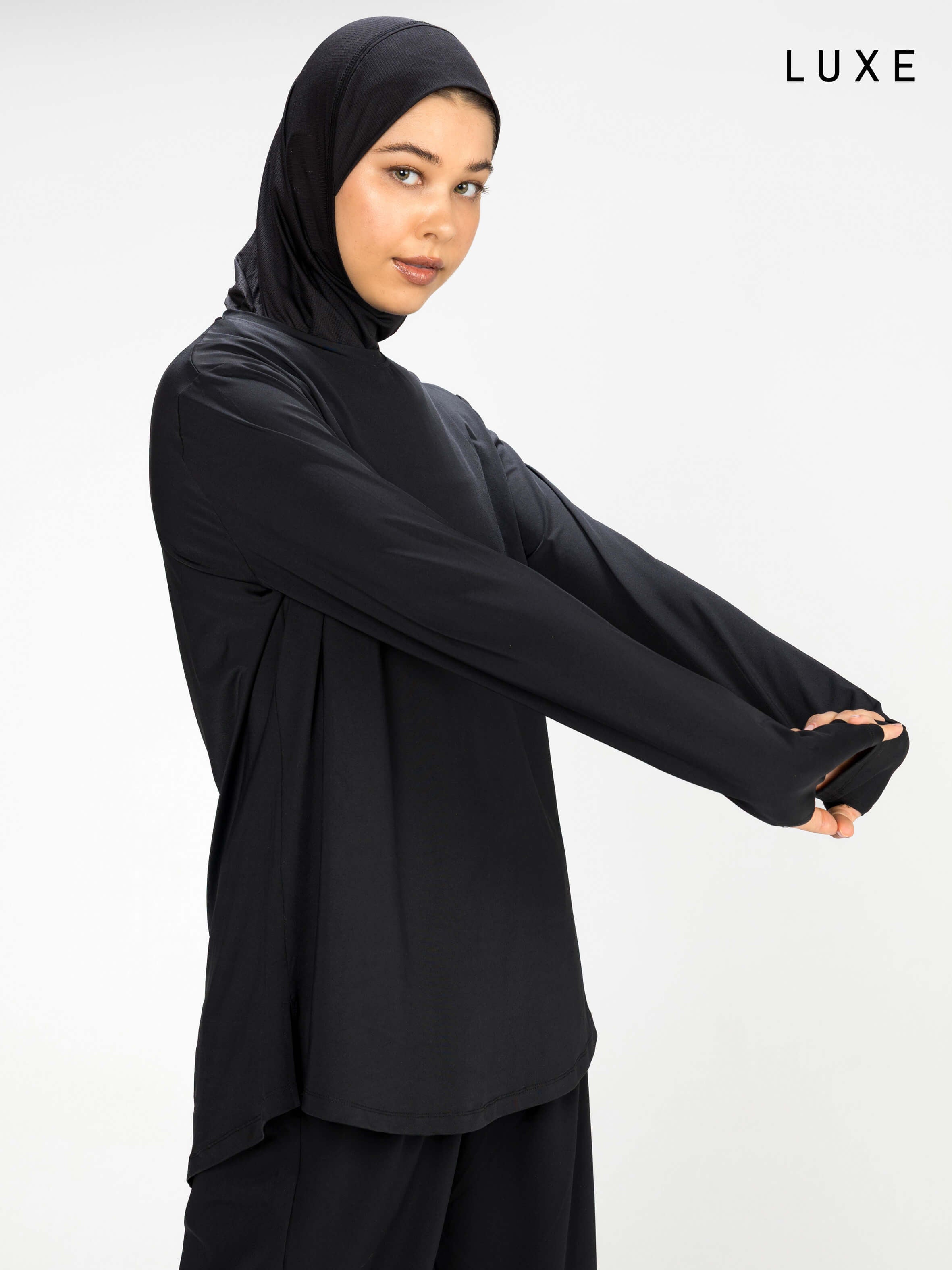 Women black long-sleeve modest sports activewear top by KAF