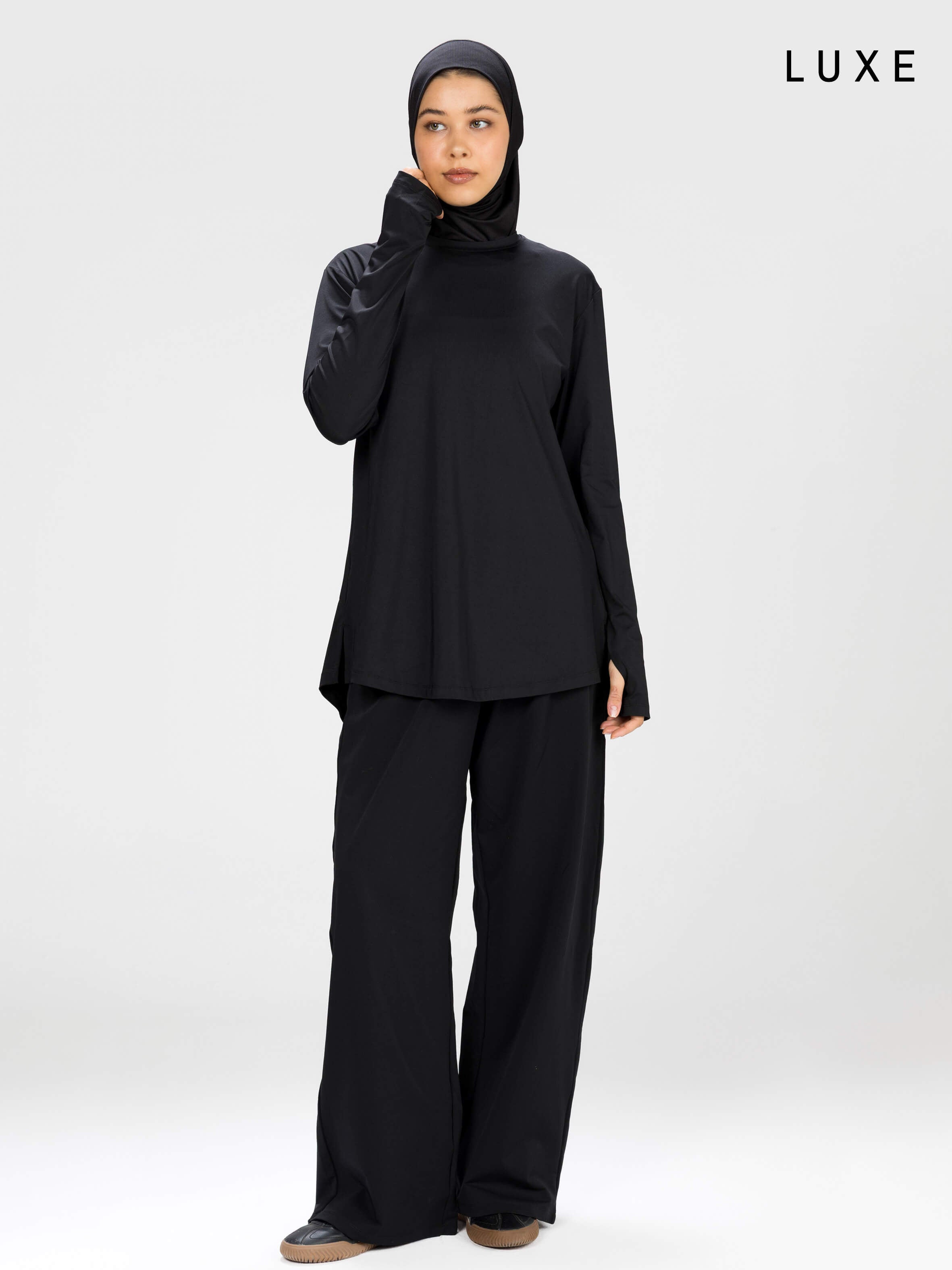 Women black long-sleeve modest sports activewear top by KAF